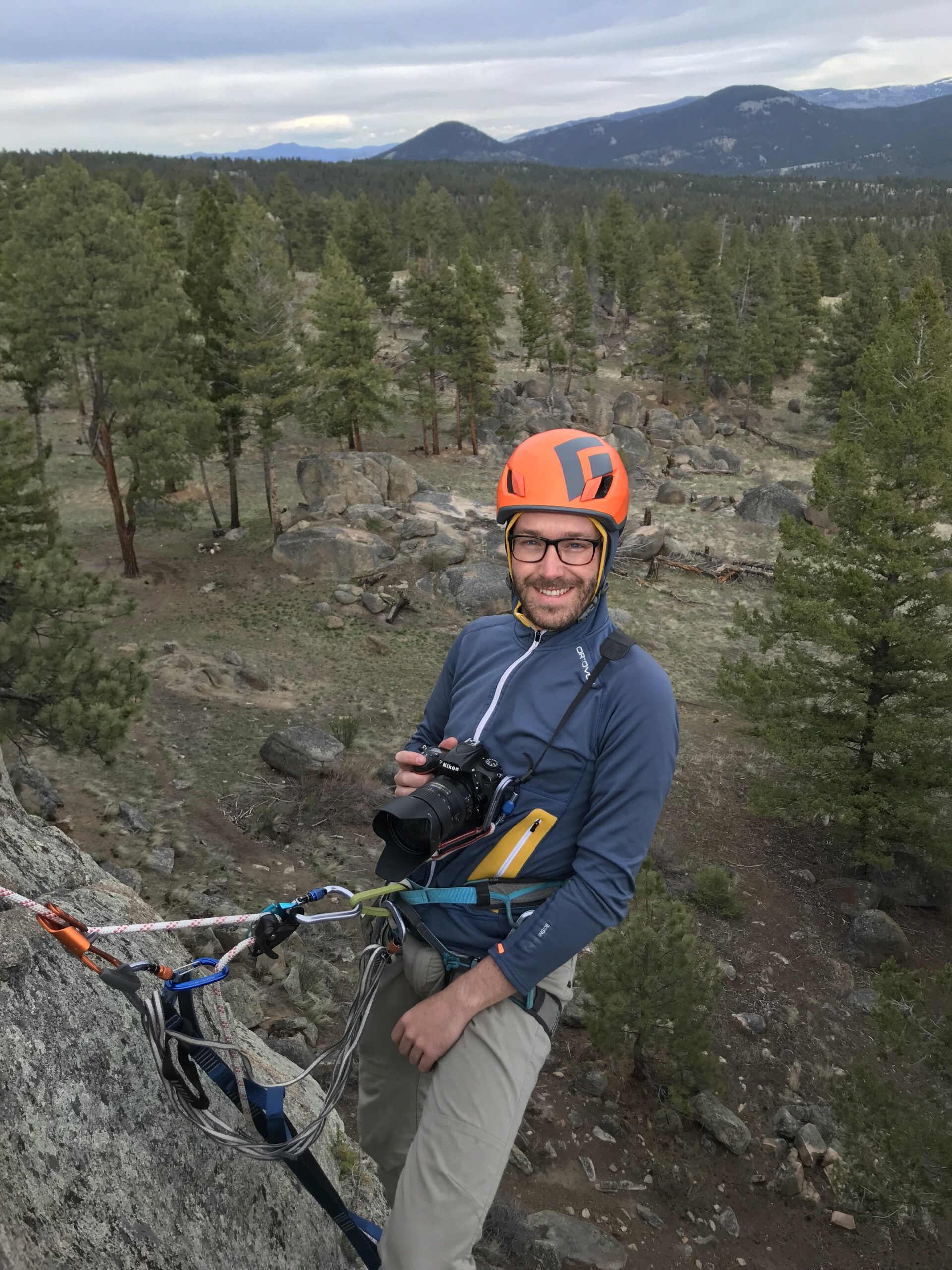 <p>Joshua Murdock, editor of The Monitor, using vertical rope ascending and rappelling techniques to