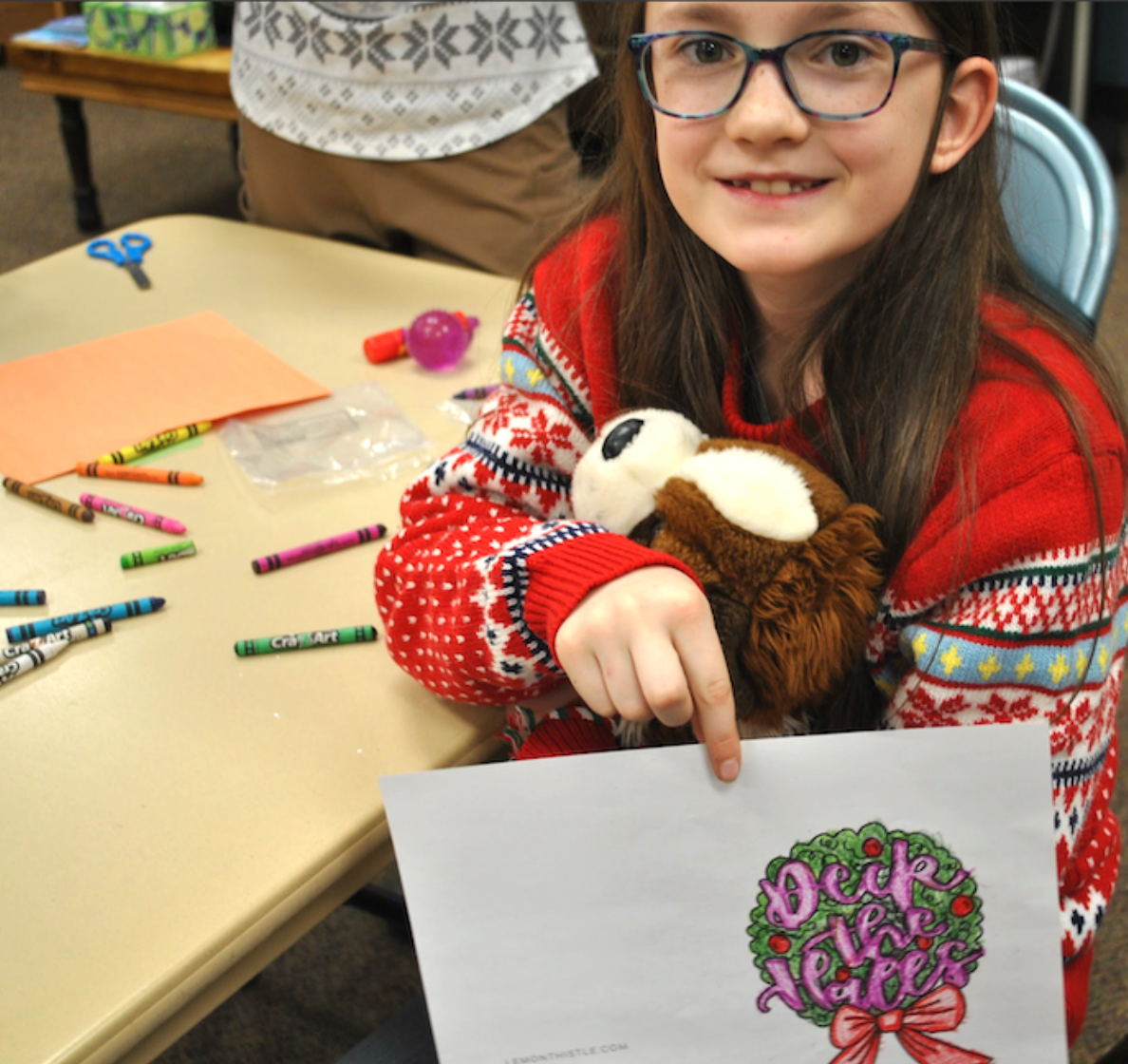 <p>Brook Park shows off her Christmas card (Eliza DuBose/The Monitor)</p><p>Brook Park shows off her