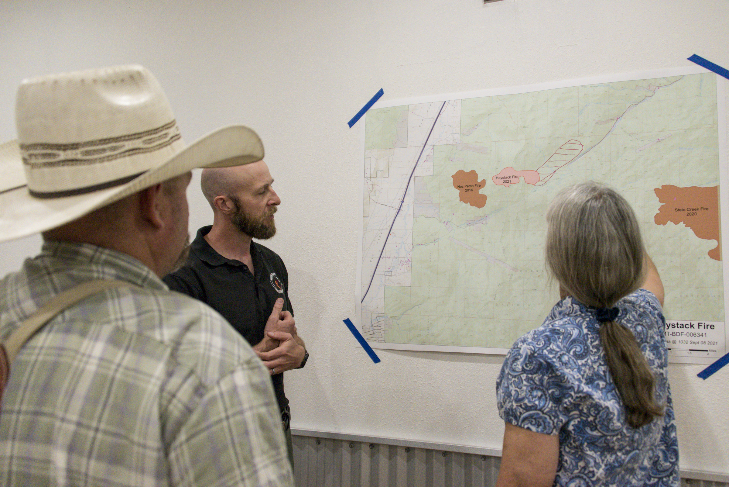 <p>Shane Martin (center), the assistant fire management officer for the Butte Ranger District of the